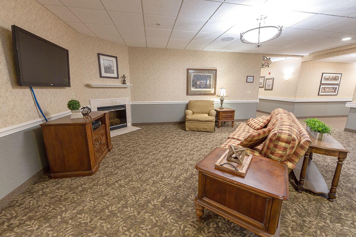 A cozy and well-decorated living room with comfortable furniture and warm lighting.