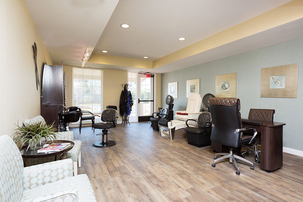 A modern salon interior with seating and spa chairs, offering a relaxing ambiance.