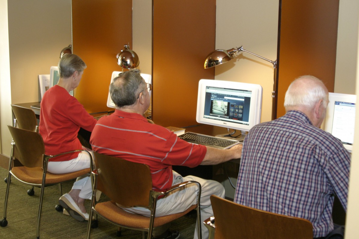 People working on computers in an office setting.