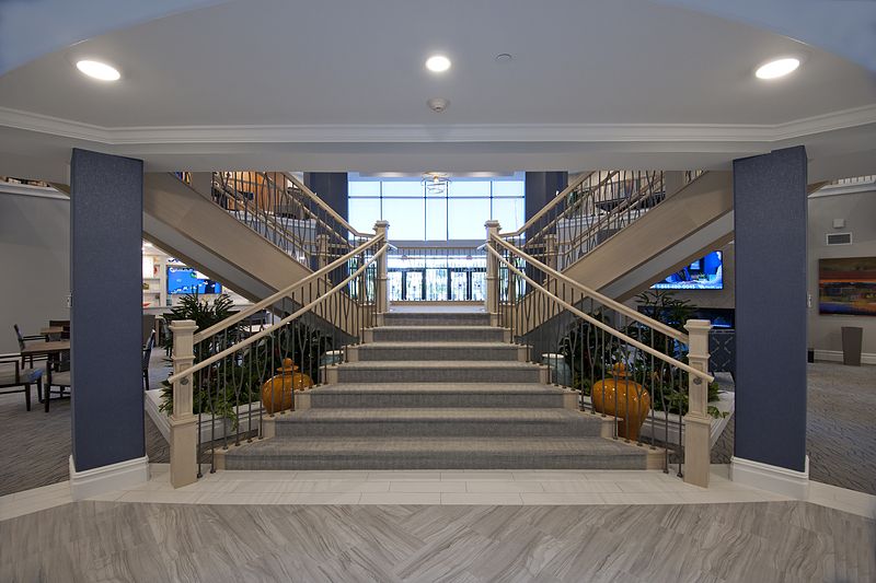 A luxurious lobby featuring a grand symmetrical staircase.