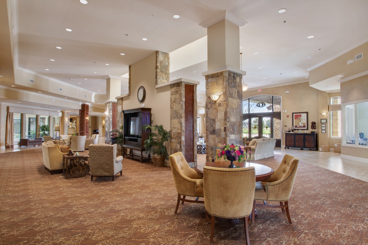 A modern and spacious lobby with elegant seating and decor.