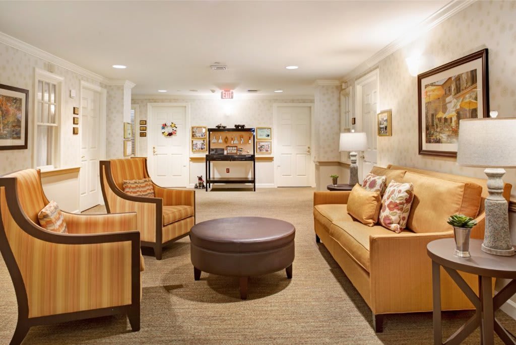 A cozy living room with comfortable seating and elegant decor.