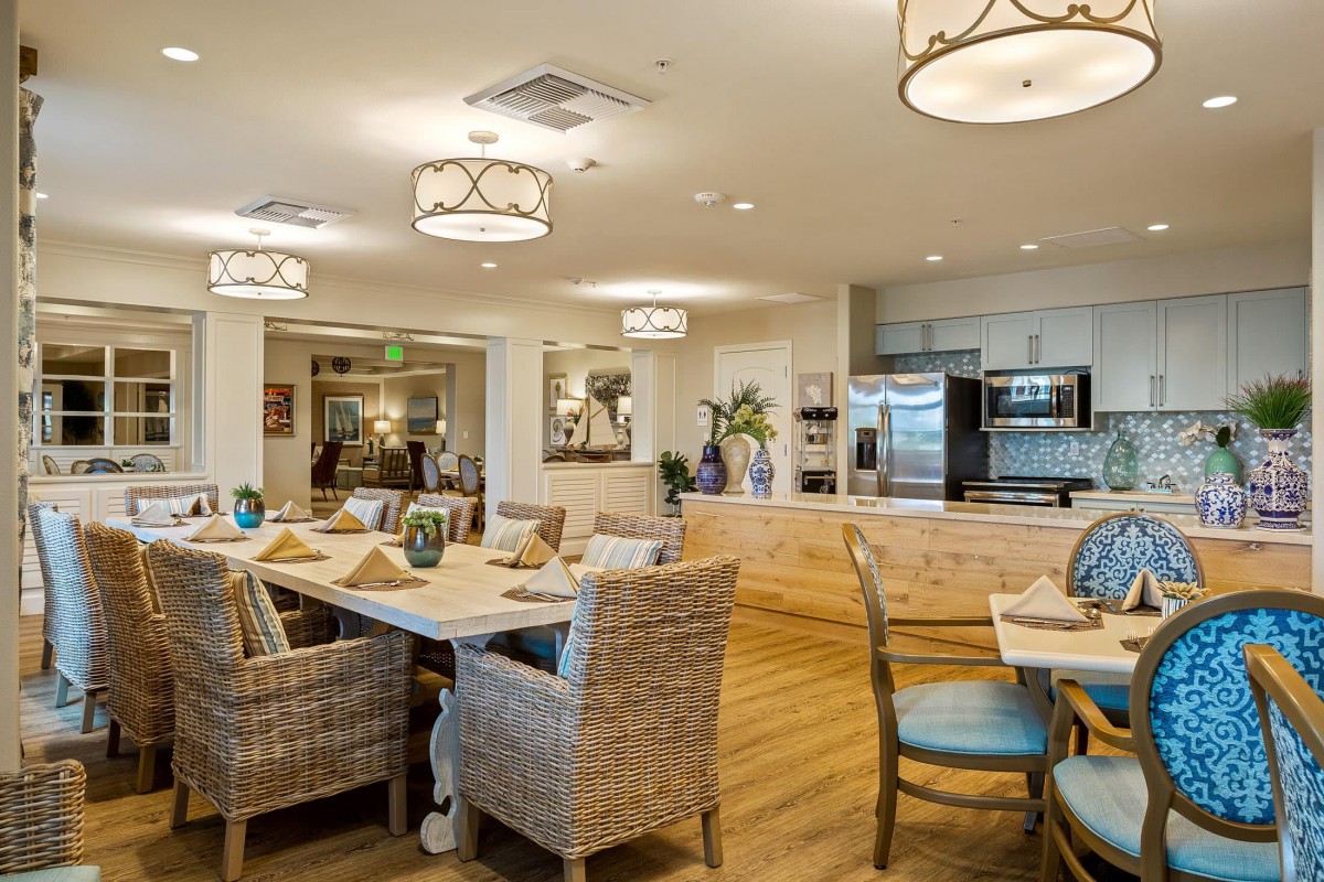 A modern, cozy dining area with stylish furniture and warm lighting.