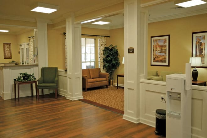 A cozy living room with comfortable seating and elegant decor.