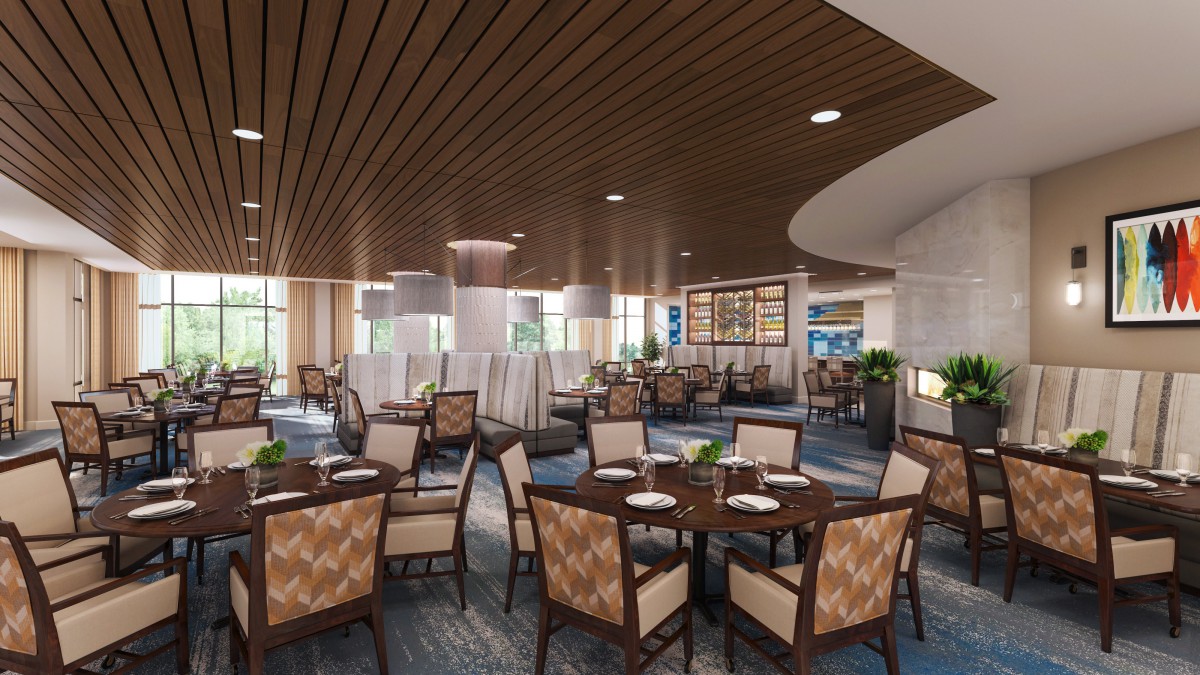 A modern restaurant interior featuring elegantly arranged tables and chairs with stylish lighting.