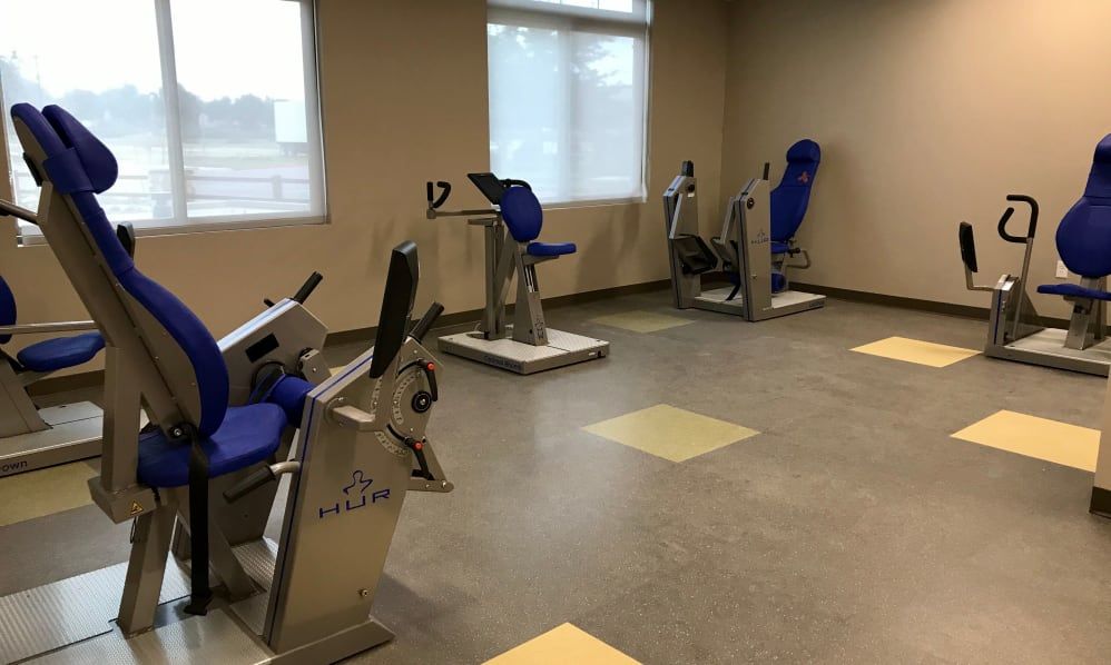 A quiet workout room with various exercise machines.