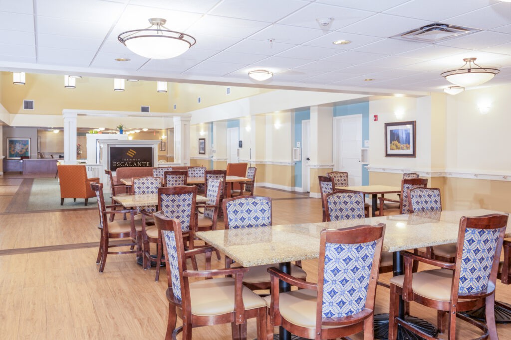 An empty dining area with neatly arranged tables and chairs.