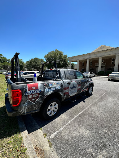 A customized pickup truck parked in a sunny outdoor setting.