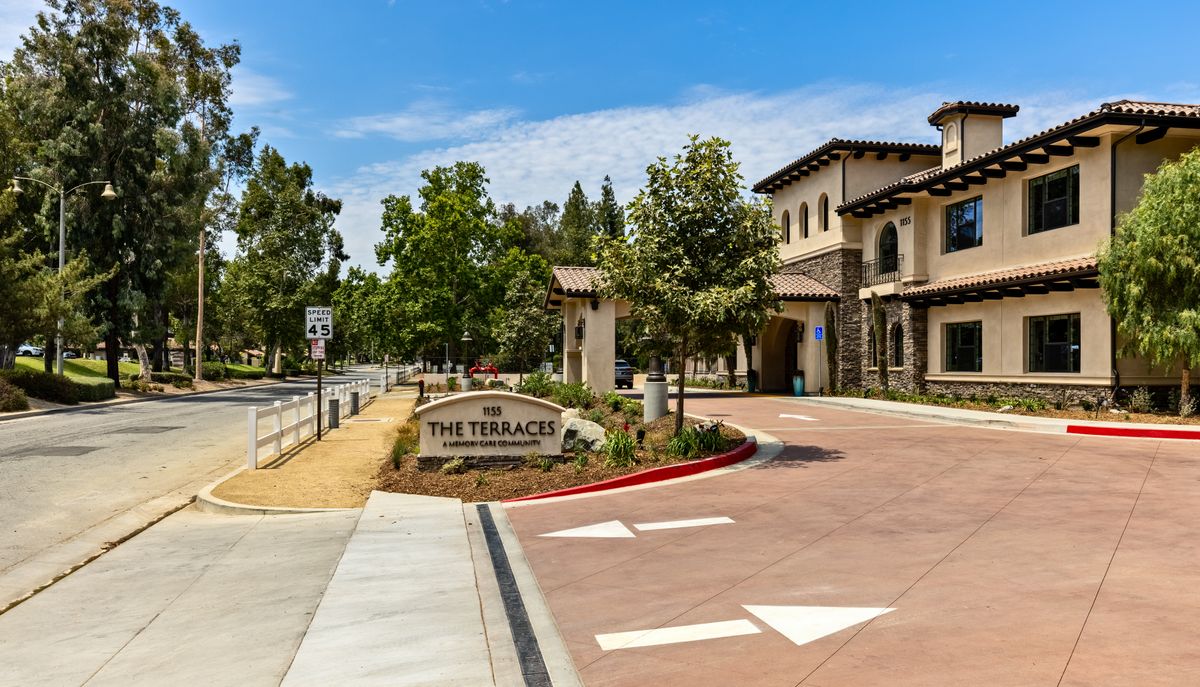 Entrance to The Terraces with landscaped surroundings and clear signage.