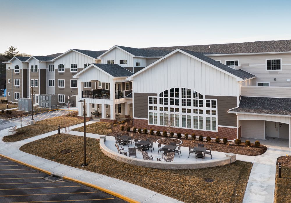 A modern residential building with a spacious outdoor area.
