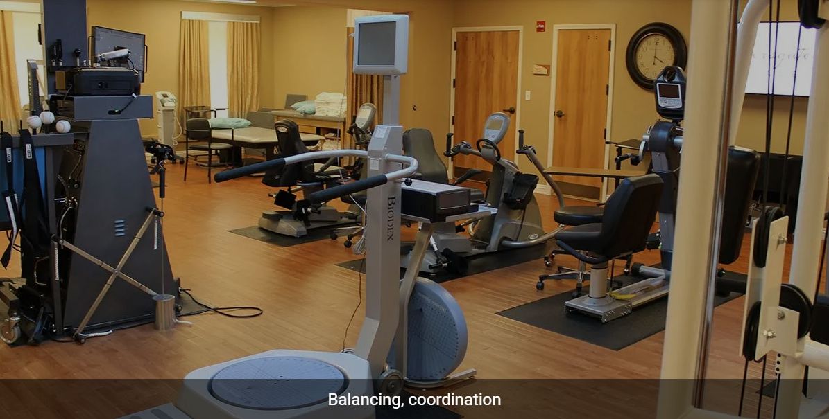 A rehabilitation gym with exercise equipment designed for balance and coordination training.