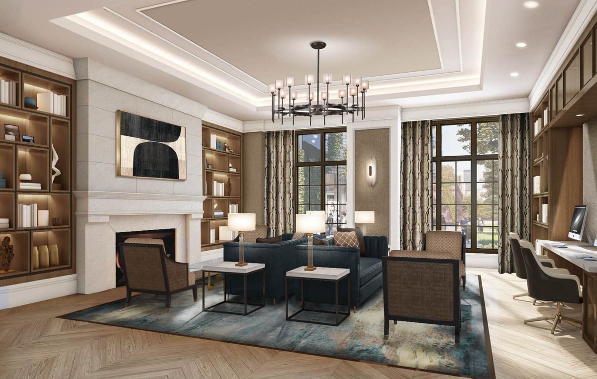 A modern living room featuring elegant furniture, a central chandelier, and large windows.