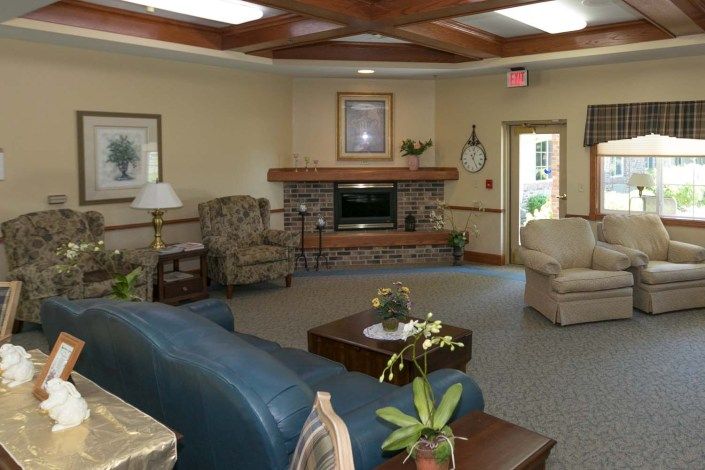 A cozy living room with comfortable seating and a fireplace.