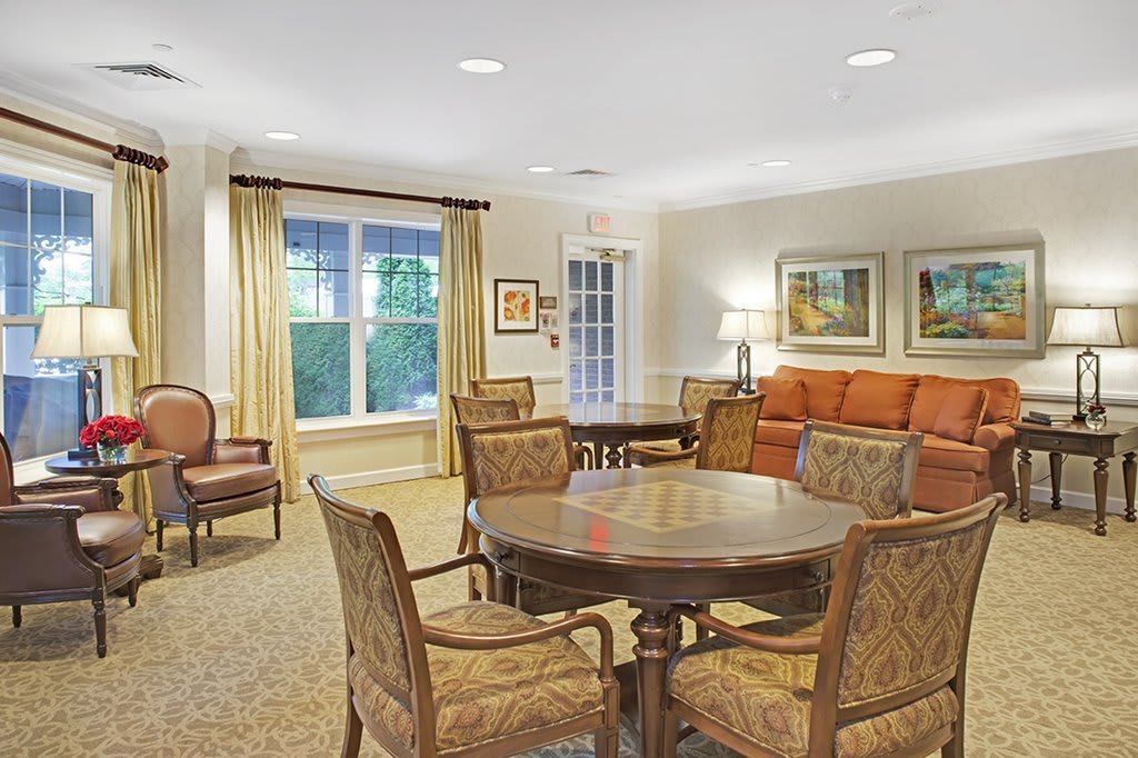 A cozy living room with classic furniture and warm lighting.