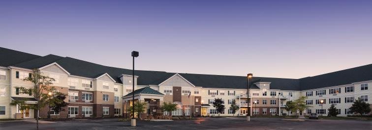 A hotel building exterior photographed during the evening.
