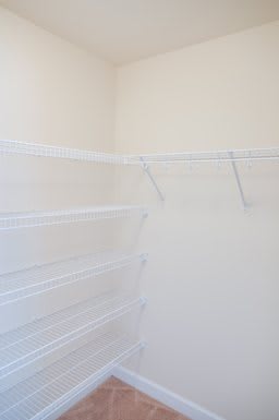 An empty closet with wire shelving for storage and organization.