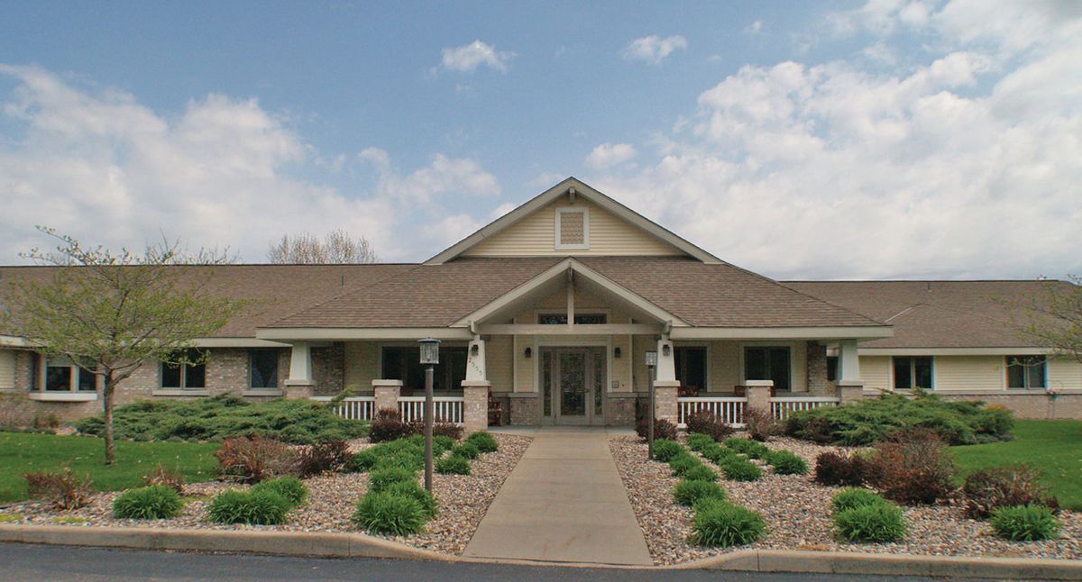 A single-story house with a pitched roof and well-maintained landscaping.