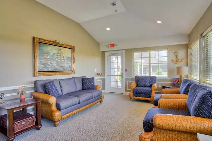 A cozy living room with comfortable seating and warm lighting.