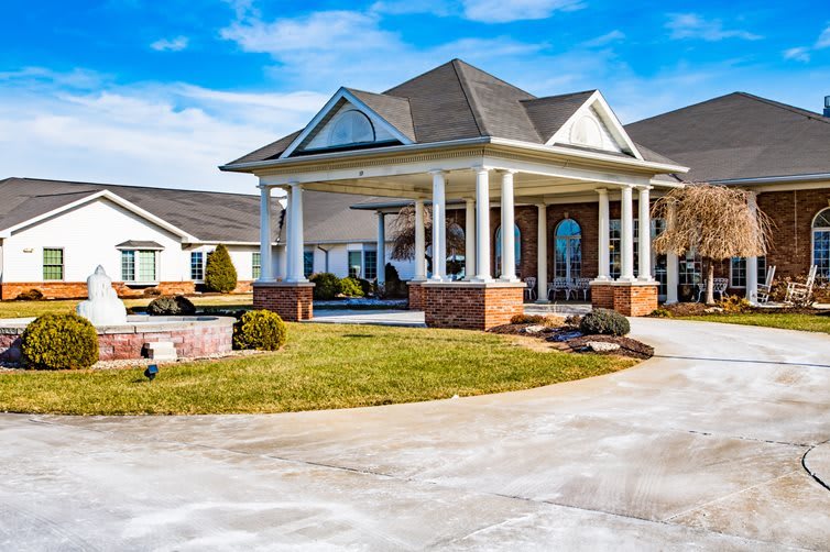 A beautiful residential home with a spacious driveway and landscaped garden.