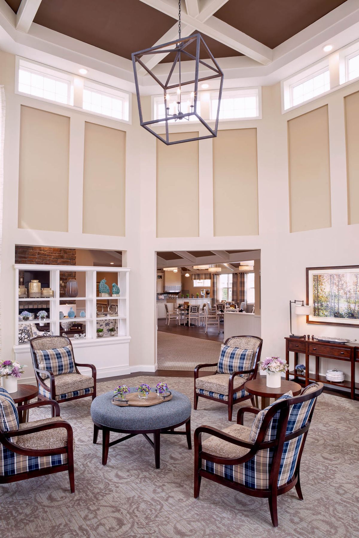 A well-lit living room featuring comfortable seating arrangements and stylish decor.