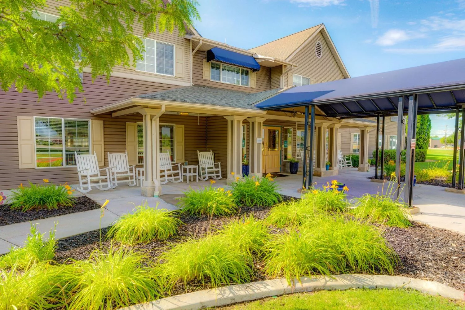 A beautiful residential house with a well-maintained garden and welcoming porch.