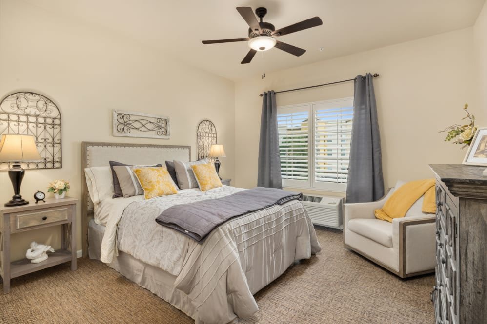 A cozy bedroom with neutral tones and stylish decor.