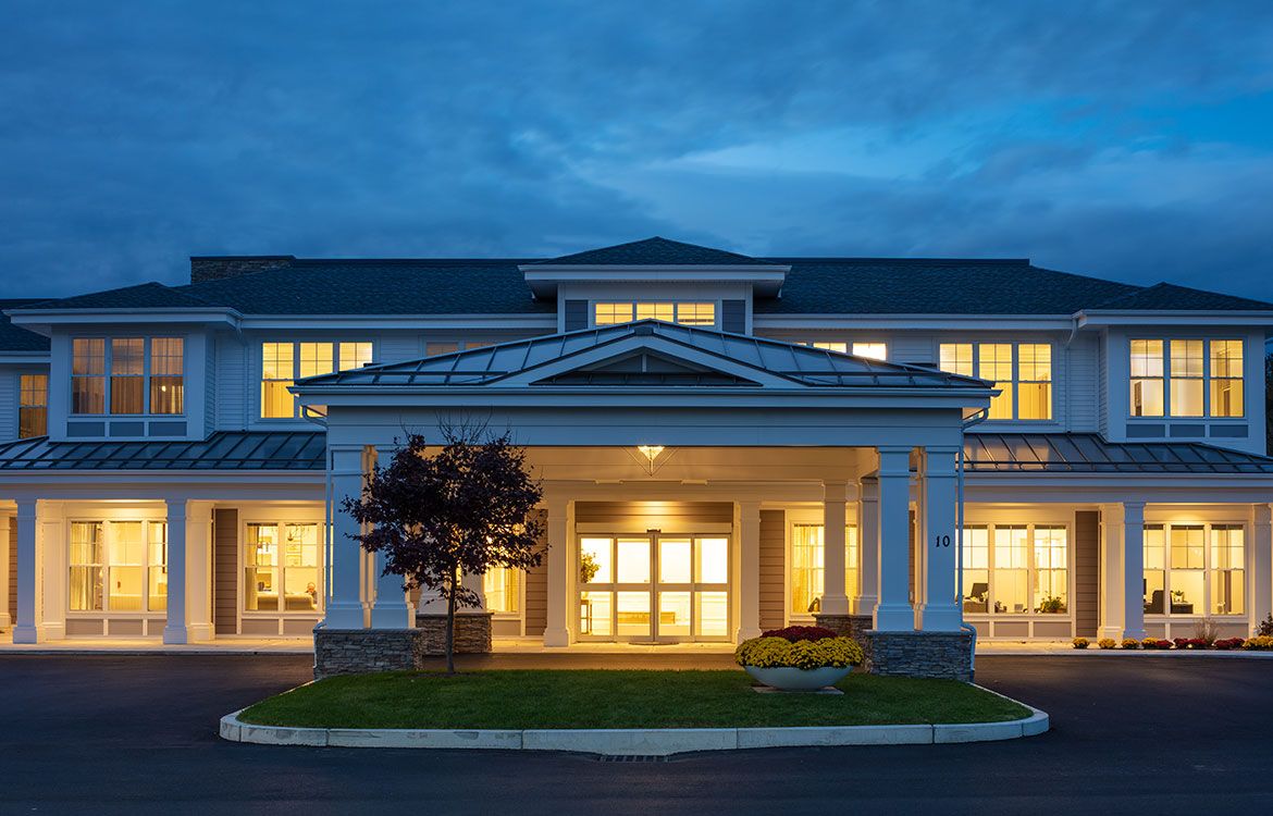 A well-lit residential building entrance at night.