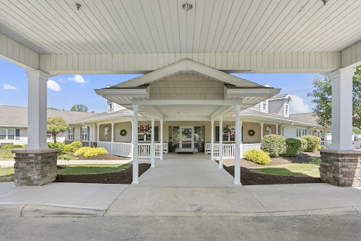 Welcoming entrance of a residential building with well-maintained landscaping.