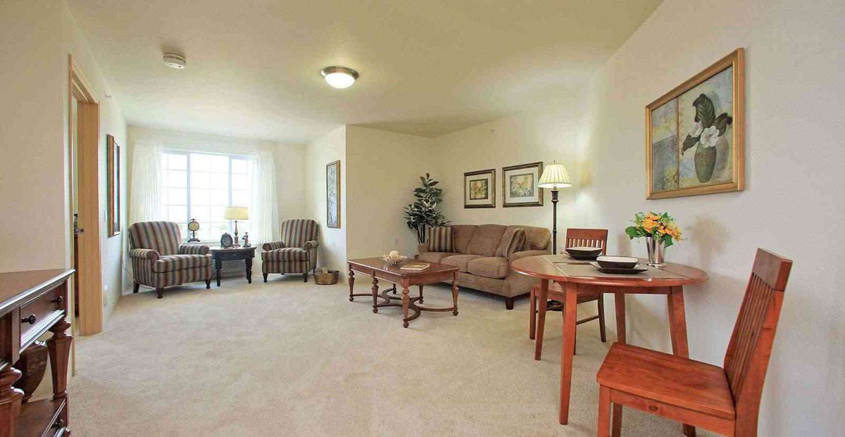 A cozy living room with comfortable furniture and warm lighting.