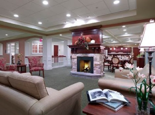 A cozy living room setting featuring a warm fireplace and comfortable furniture.