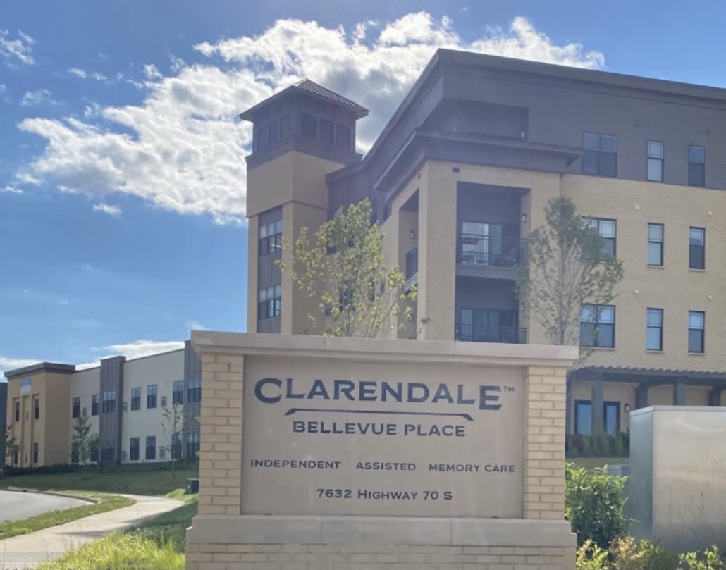A view of Clarendale Bellevue Place with a clear blue sky in the background.