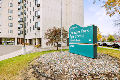 Entrance to Pioneer Park Apartments, showcasing the building and signage.