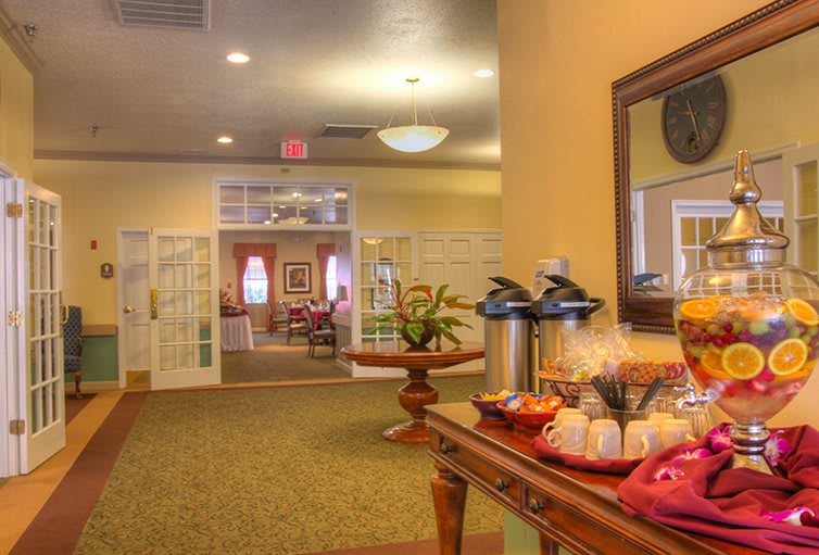 A cozy hallway with a coffee station and warm lighting.