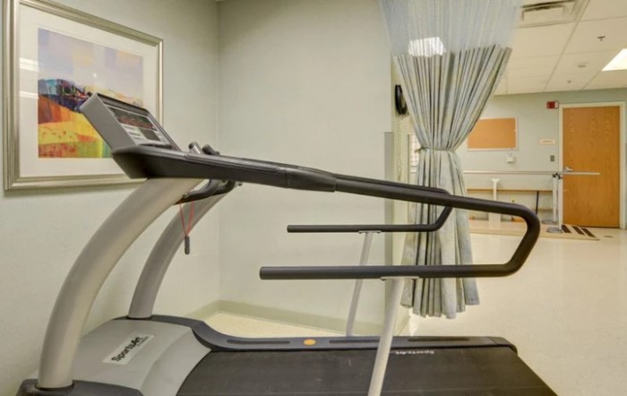 A treadmill is set up in a fitness room, ready for use.