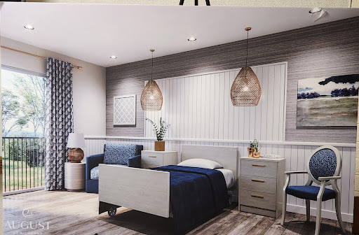 A modern bedroom featuring a blend of blue and gray tones, stylish pendant lights, and contemporary furnishings.