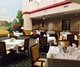 Elegant restaurant dining area with neatly arranged tables and chairs.