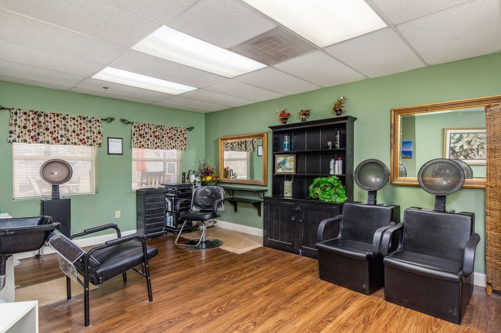 A modern hair salon with comfortable seating and stylish decor.