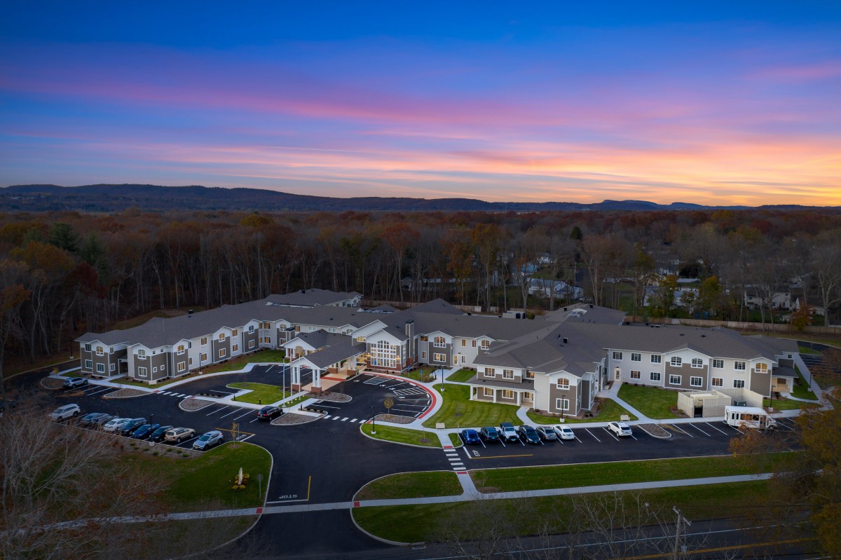 Aerial view of a residential apartment complex at sunset.