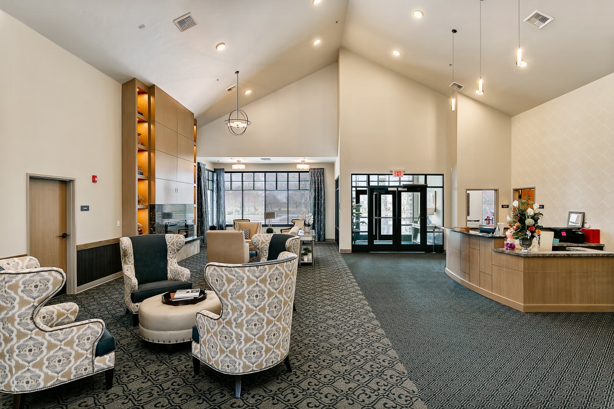A modern and spacious lobby with comfortable seating and elegant lighting.