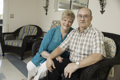 A happy couple enjoying each other's company indoors.