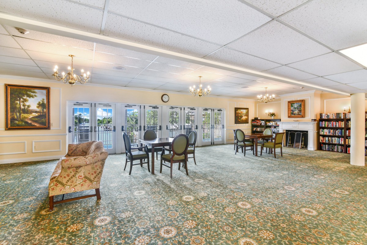 A spacious lounge area with elegant furnishings and ample natural light.
