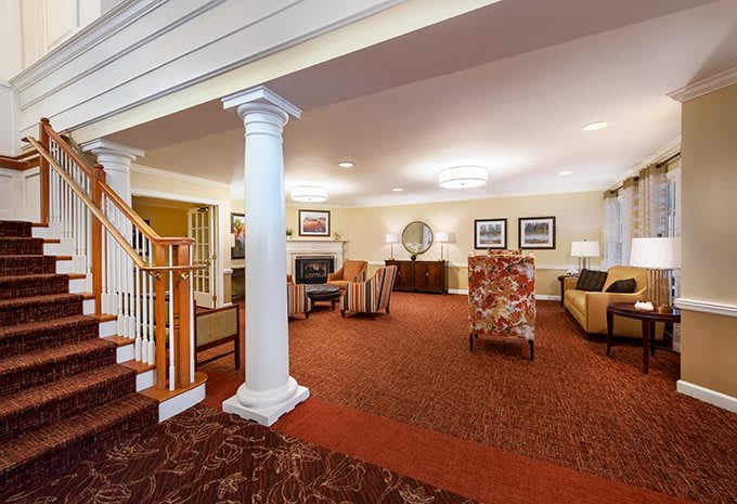 Spacious living area with elegant furniture and classic decor.
