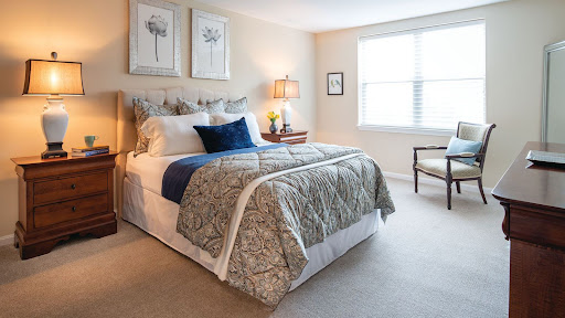 A cozy and elegantly decorated bedroom with a comfortable bed and soft lighting.