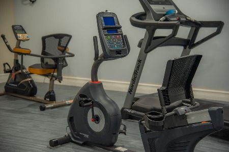 An exercise bike in a fitness room, ready for a workout session.