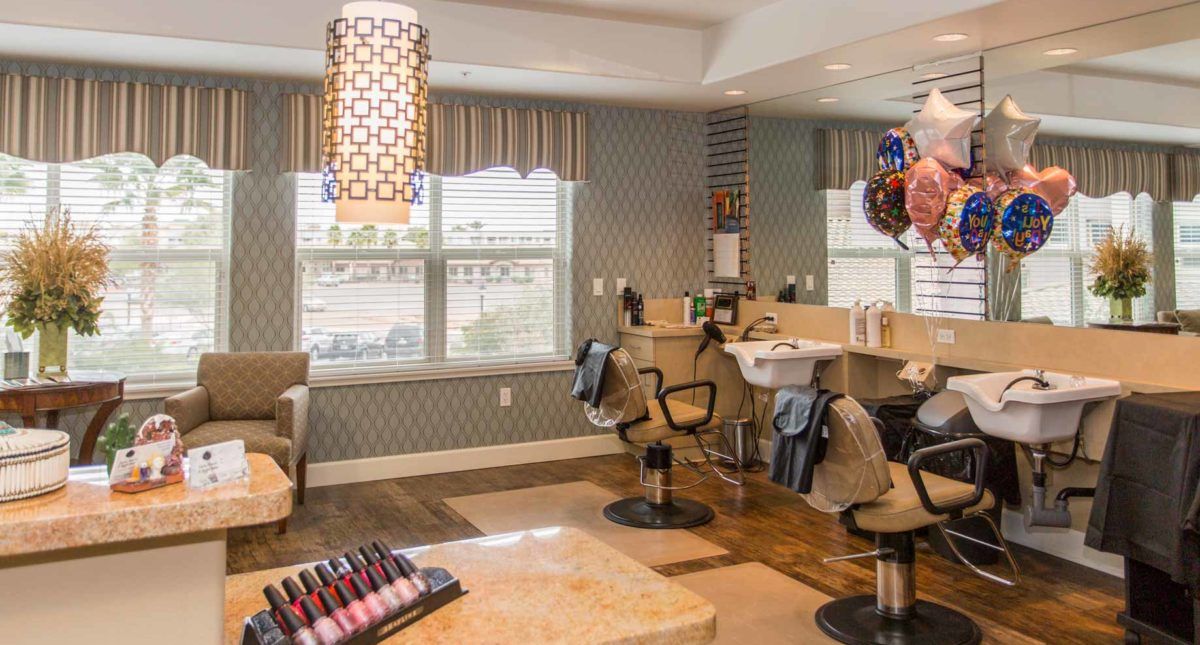 A modern hair salon interior with stylish decor and comfortable seating.
