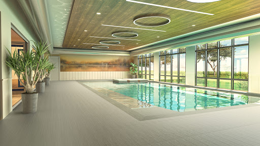 A serene indoor pool area featuring modern architecture and abundant natural light.