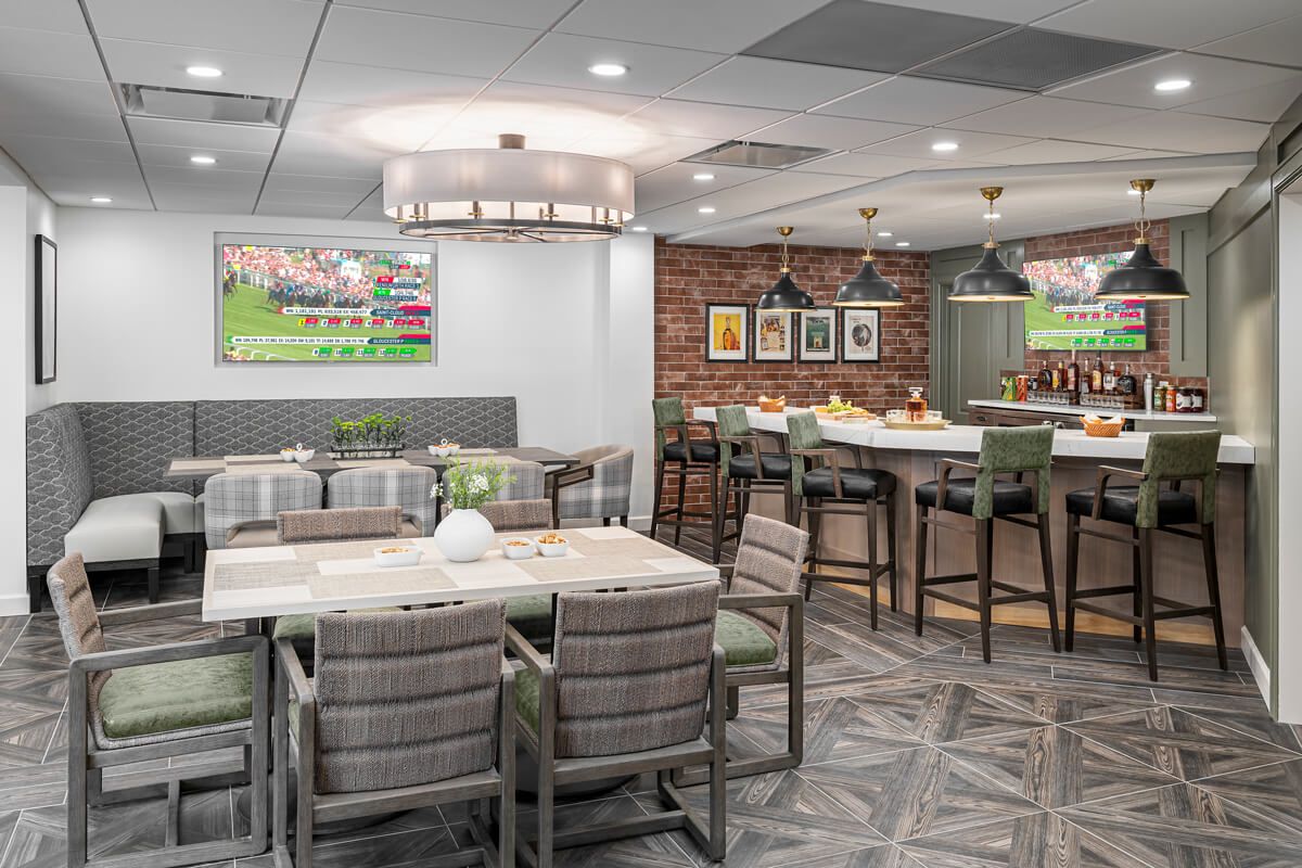 A modern restaurant interior with a mix of dining tables, bar seating, and stylish decor.