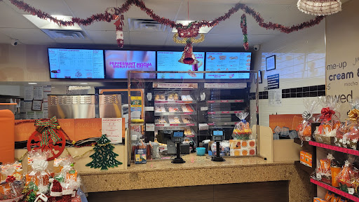 A festive fast-food restaurant counter decorated for the Christmas season.