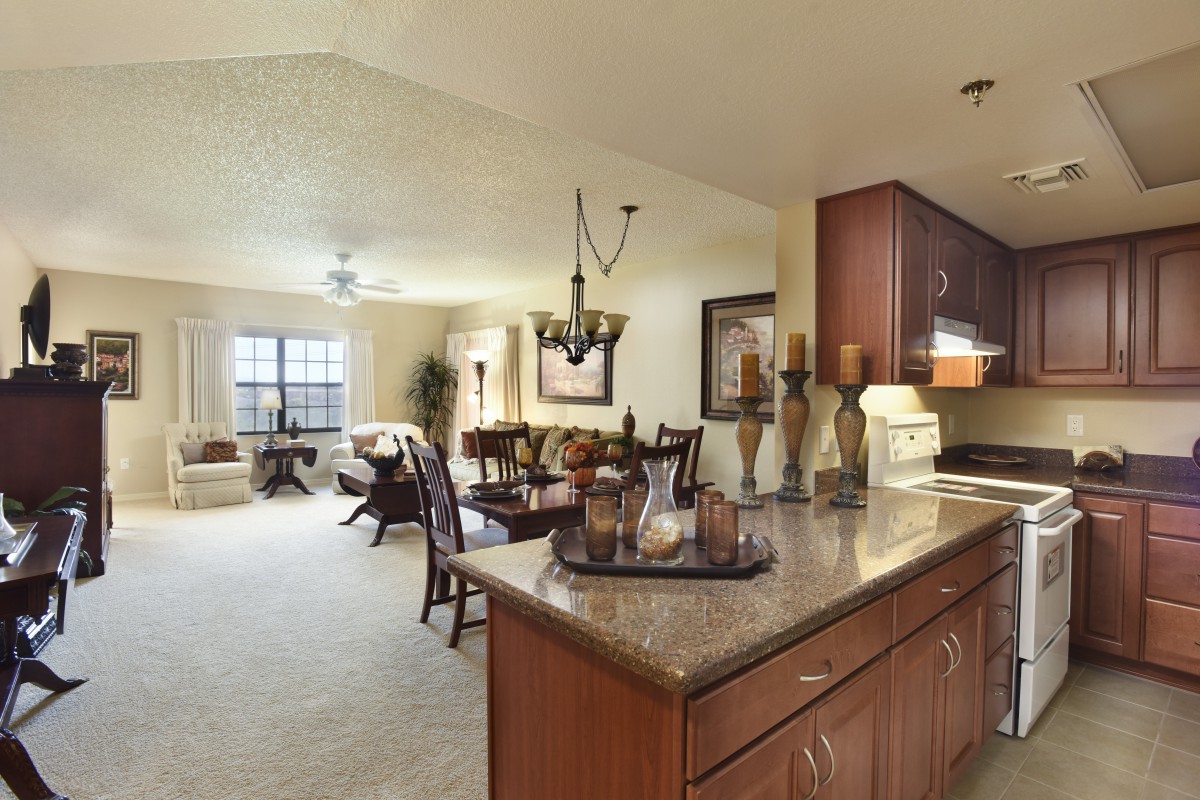 A spacious open floor plan featuring a modern kitchen and dining area with stylish decor.