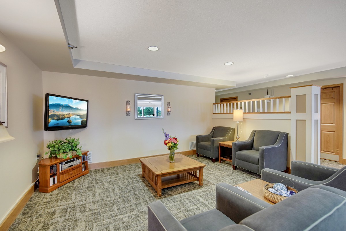 A cozy living room with comfortable seating and a television.